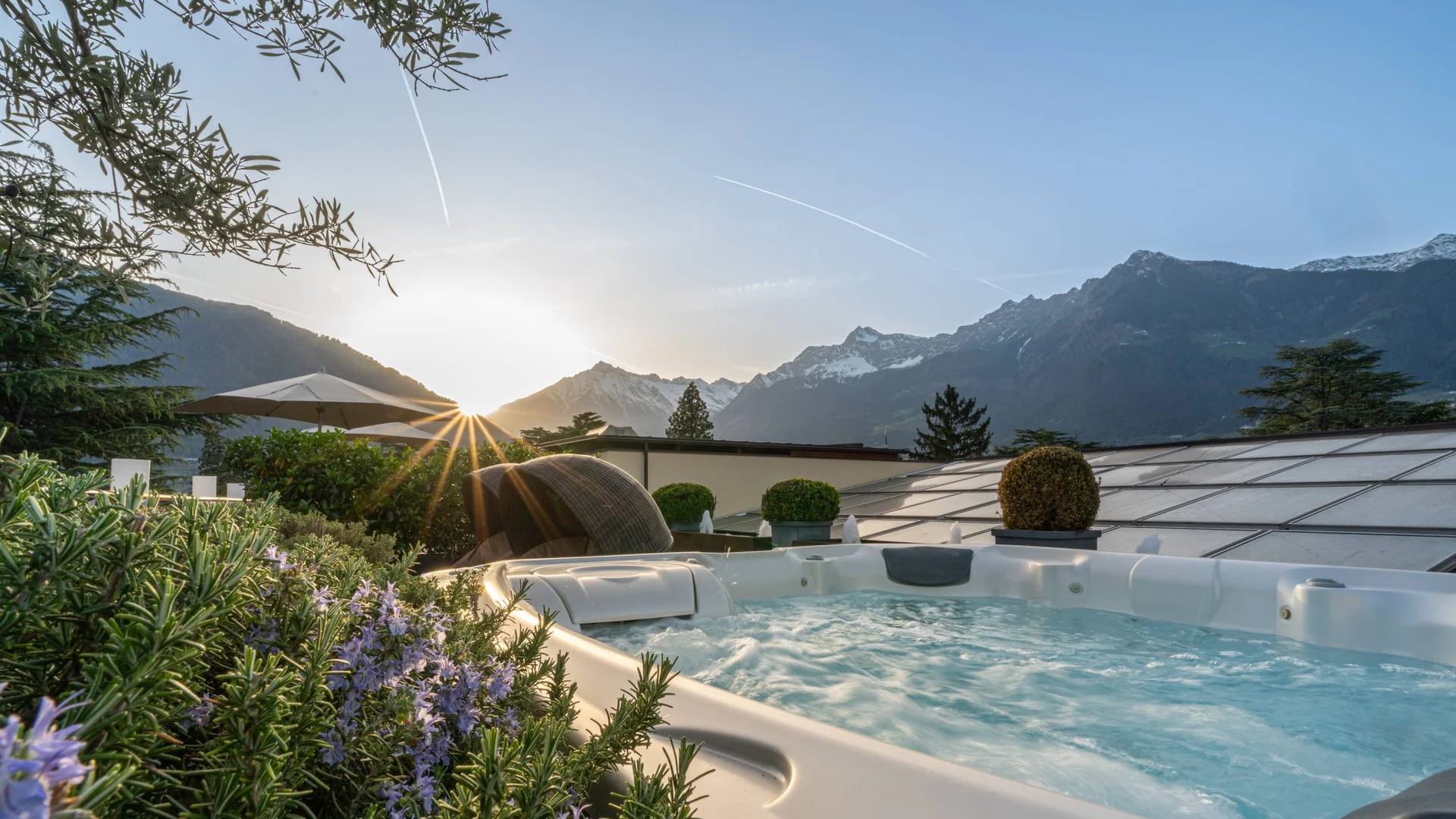 Hot tub on terrace with mountain view at sunset