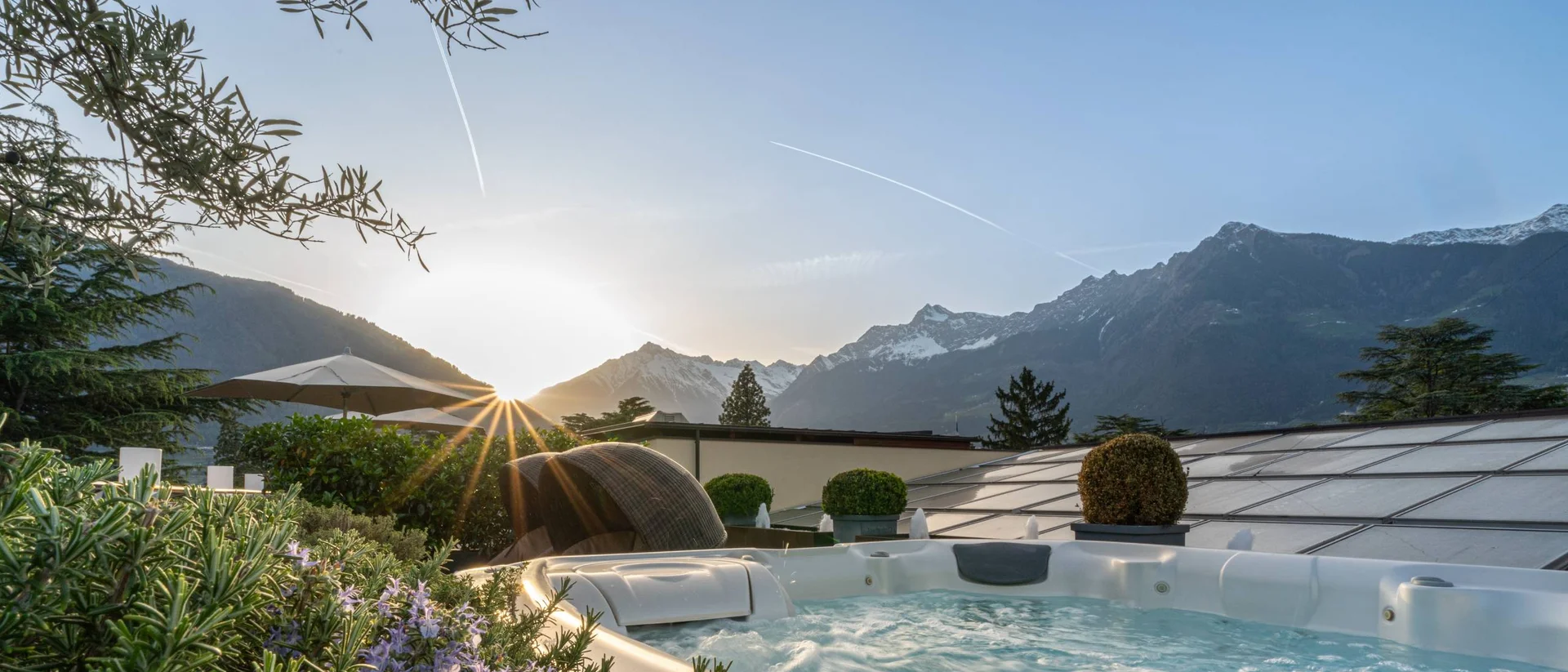 Hot tub on terrace with mountain view at sunset