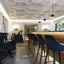 Elegante Hotelbar mit geometrischer Decke und modernen Sitzgelegenheiten
